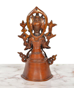 Back view of brass seated Tara Devi statue with star-like halo details