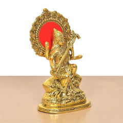 Saraswati Maa idol holding veena, golden metal with red halo medallion