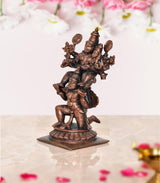 Copper Vishnu decorative showpiece, side view of multi-armed figure with headdress and halo