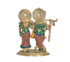 Brass Radha-Krishna idol rear view: peacock-feather halos, Krishna flute; colorful motifs