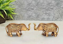 Golden brass elephant figurine set of 2, ornate detailing, one trunk raised and one lowered