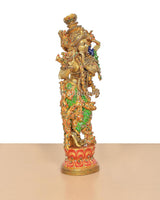 Brass Lord Krishna flute-playing idol with multicolor meenakari work, side profile