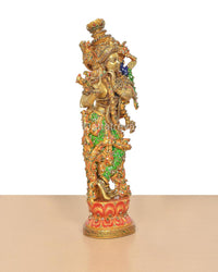 Brass Lord Krishna flute-playing idol with multicolor meenakari work, side profile