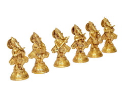 Six brass musical Ganesha idols lined up, each holding small musical accessories