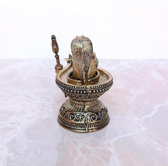 Brass Shiva ling murti detail view with trident and Nandi, engraved round base