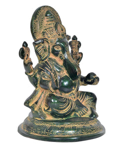 Lord Ganesha brass statue, angled view, detailed face and four arms, seated on pedestal