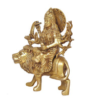 Durga Maa statue on lion, side view with ornate crown and multi-armed weapons