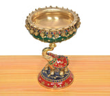 Brass elephant urli idol with empty gold bowl, painted base and jeweled details