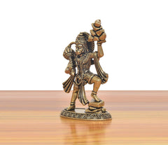 Brass Hanuman murti side view with patterned base and raised gada