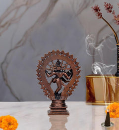 Copper Natraja dancing Shiva idol figurine, back view with circular spoked halo