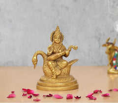 Brass goddess Saraswati idol seated on swan, playing veena, 5 inch height