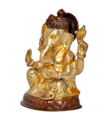 Side view brass Ganesha idol, gold-tone body with dark hair and sculpted base