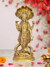 Gold-toned brass Vishnu standing idol with Sheshanaag serpent at base