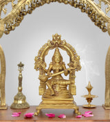Brass Saraswati idol statue holding veena, seated goddess figure on ornate base
