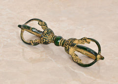 Brass small eight-pronged Dorje with green accents and engraved details