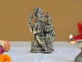Lakshmi Narasimha brass statue standing pose, consort beside, ornate detailing on base