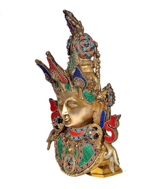 Side view Brass Tara Devi mask with multicolour jewel inlays and ornate headpiece