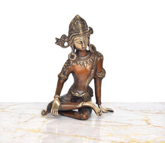 Seated brass Indra Devta statue with calm face and crown detailing, gold-toned accents