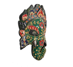 Ganesha metal wall mask side view, green face with floral beadwork and ear details