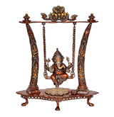 Brass Ganesha swing idol on round base with detailed columns and chains