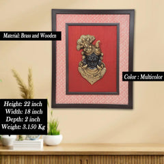 Framed Shreenath ji brass face idol on red panel with textured outer border