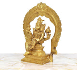 Brass Shiva and Parvati figurine, side view showing seated figures and decorative arched back.