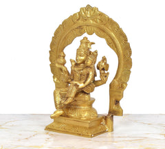Brass Shiva and Parvati figurine, side view showing seated figures and decorative arched back.
