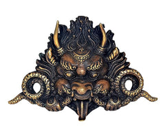 Brass cheepu mask with dragon-faced design, gold details and circular accents