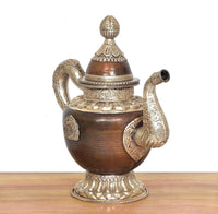 Brass teapot showpiece with dark bronze body, side curved handle, and ornate lid finial