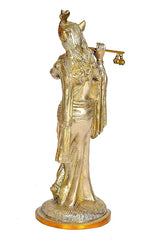 Brass Krishna figurine rear view, long hair details, ornate robe, circular base