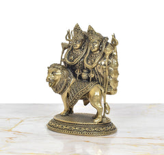 Kaila Devi Chamunda brass statue riding lion, three-quarter angle