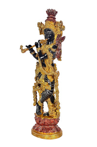 Brass Krishna idol figurine with flute, red-and-gold crown, raised draped hands