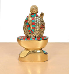 Rear view of Shirdi Sai Baba brass statue, multicolor robe and lotus base with circular rim