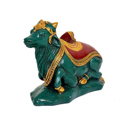 Polyresin Nandi with red saddle, gold detailing, side pose, seated on base