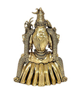 Brass goddess idol rear view, gold tone engraved texture on crown and layered dress