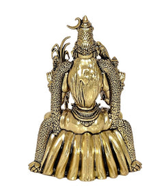Brass goddess idol rear view, gold tone engraved texture on crown and layered dress