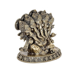 Angled view of brass Panchmukhi Ganesha idol statue, detailed trunk and base