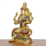 Lakshmi idol statue, side view with seated pose, gold finish, red and green gemwork