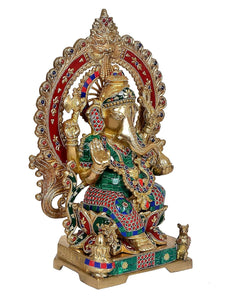 Brass Ganesha statue with Kirtimuka frame, seated on lotus base, detailed jewelry