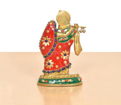 Radha-Krishna brass idol rear side, red dress with floral motifs, green trim, beaded accents