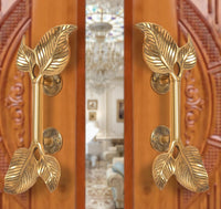 Golden brass twin-leaf door handle pair with round latch plates