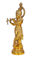 Brass Krishna murti side view, holding flute, highly detailed crown and robe