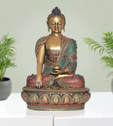 Brass meditating Buddha statue with jeweled drape in turquoise and red, dhyan mudra hands