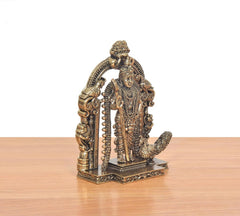 Brass Murugan statue side/back view, detailed beaded ornaments on arched prabhavali
