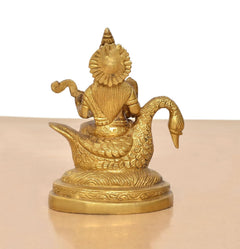 Brass Saraswati idol on swan, opposite angle showing swan tail and base