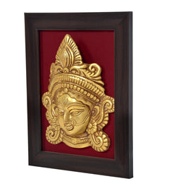 Brass Maa Durga idol head relief, angled view in dark wooden framed wall hanging