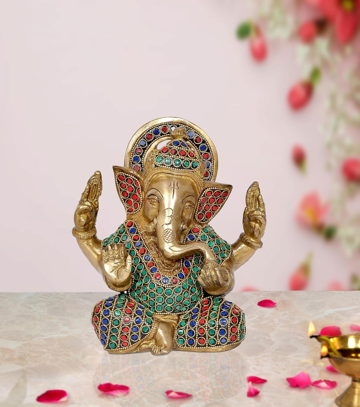 Ganesha brass idol with seated pose, colorful gem-patterned robe and four raised hands