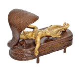 Brass Vishnu yoga nidra decor, angled view showing cobra hood and reclining posture