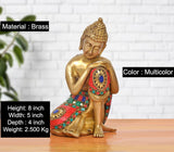 Brass seated Buddha idol with multicolor jeweled robe, 8 inch height