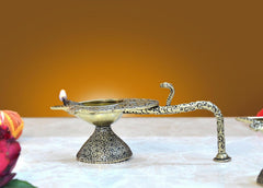Brass aarti diya with ornate handle, small oil lamp for home puja temple